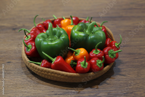 peppers and vegetables in a wicker basket