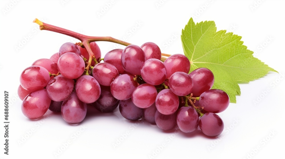 Fototapeta premium Isolated red grape with leaves on a white background .