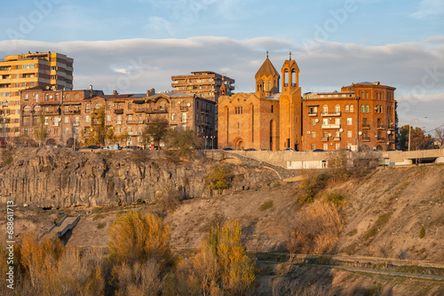 Capital Armenia. Sights Yerevan. Cityscape with rocks. Surb Sarkis church. Architecture of Armenian cities. Yerevan on summer day. Vicar church on river bank. Tour in Armenia. Excursions, travel photo