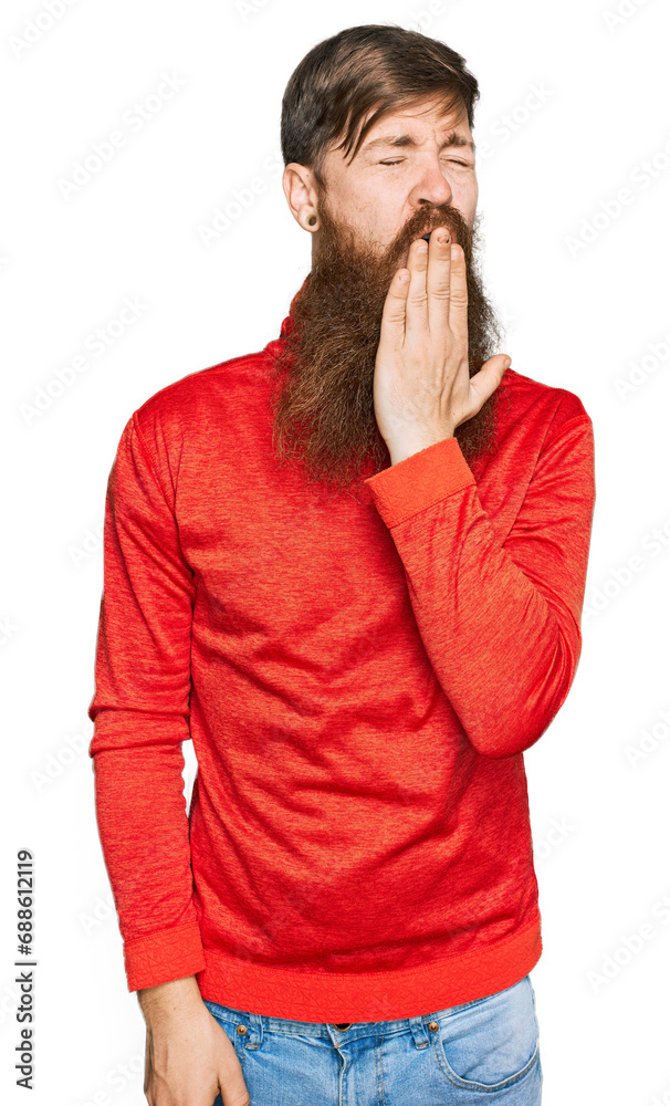 Redhead man with long beard wearing casual clothes bored yawning tired covering mouth with hand. restless and sleepiness. Redhead man with long beard wearing casual clothes bored yawning tired covering mouth with hand. restless and sleepiness.