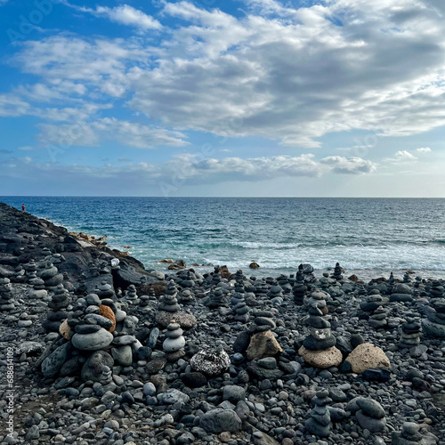 Stone figures on a beach with a beautiful sky in Tenerife. Costa Adeje. Balance and serenity