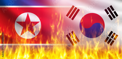 Confrontation between South and North Korea. Political flags are on fire. Confrontation between North Korea and its neighbors. Political conflict with South Korea. Burning national symbols. 3d image