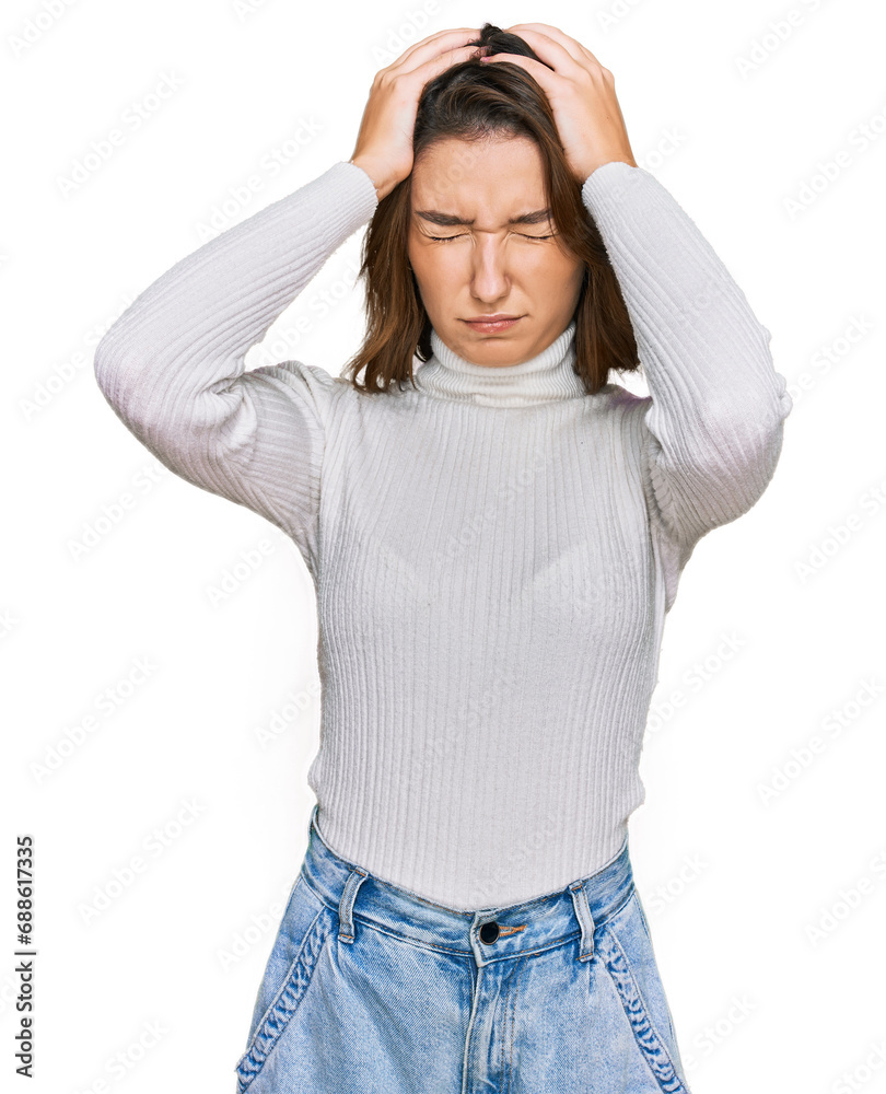 Young caucasian girl wearing casual clothes suffering from headache desperate and stressed because pain and migraine. hands on head.