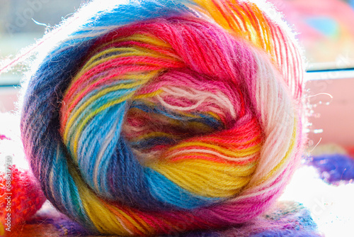 Selective focus. Multi-colored threads for knitting. Rainbow texture.