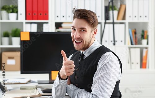 Businessman showing thumbs up in office busines peope photo