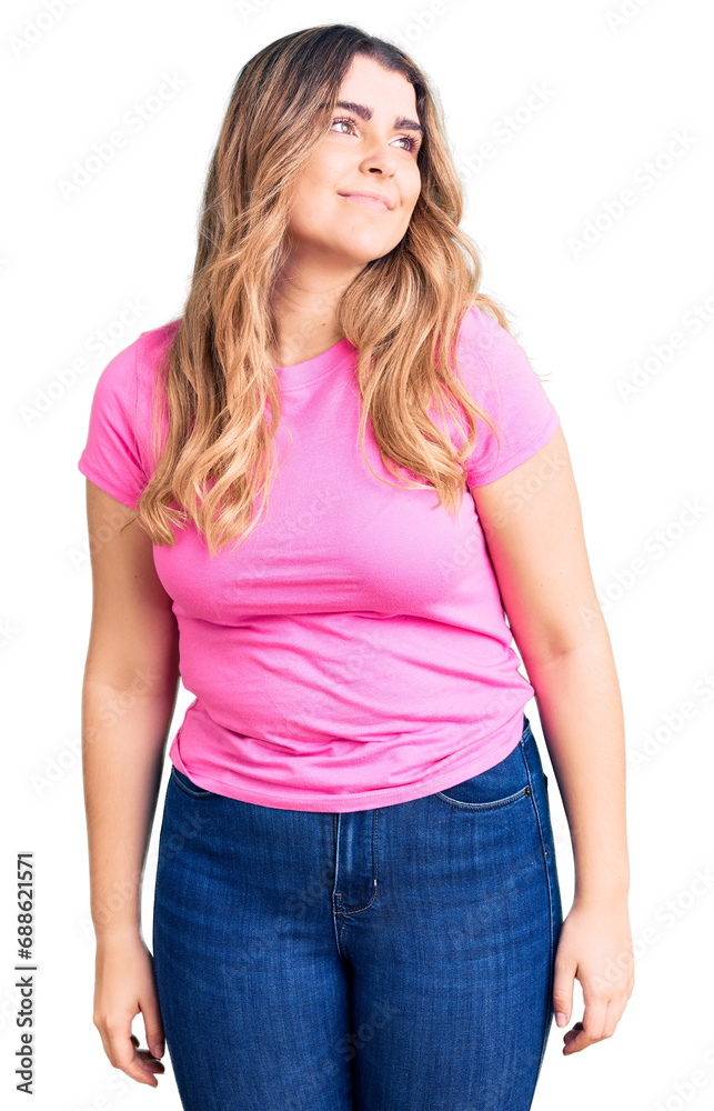 Young caucasian woman wearing sportswear looking away to side with smile on face, natural expression. laughing confident.