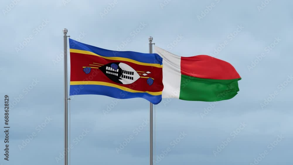 Madagascar flag and Eswatini flag waving together on cloudy sky, endless seamless loop, two country relations concept Madagascar flag and Eswatini flag waving together on cloudy sky, endless seamless loop, two country relations concept
