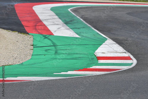 colored curbs on a racing track © Dan74
