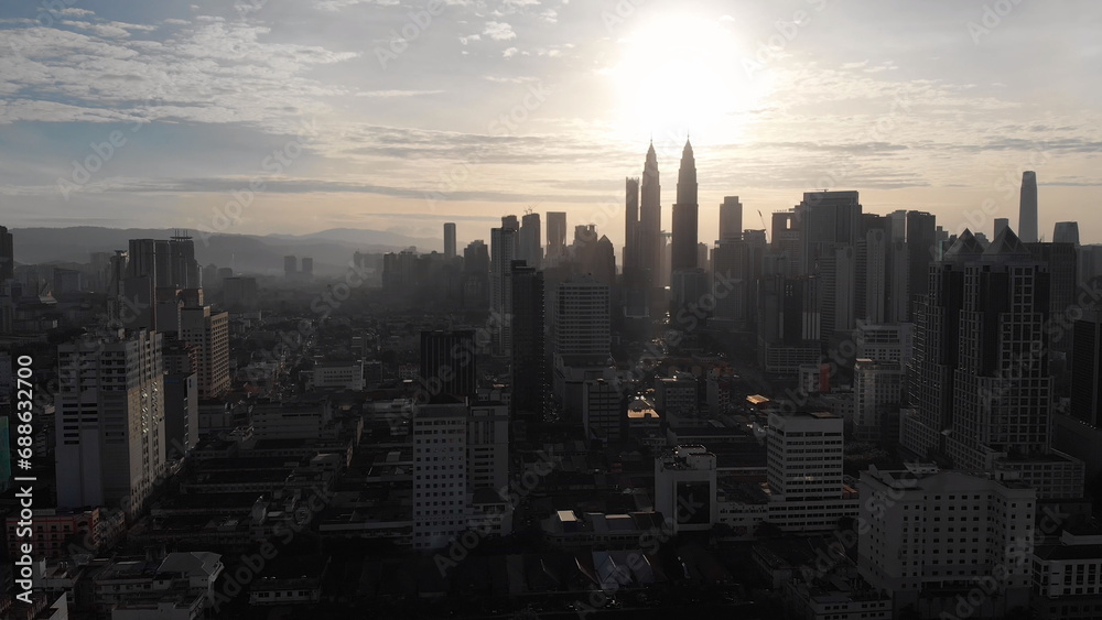 Aerial view of the silhouette of skyscrapers and the city center of Kuala Lumpur.