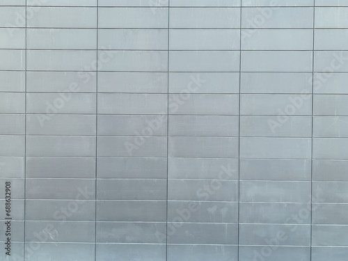 gray metal wall with cells as background