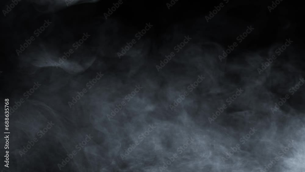 Atmospheric smoke 4K Fog effect. VFX Element. Haze background. Abstract smoke cloud. Smoke in slow motion on black background. White smoke slowly floating through space against black