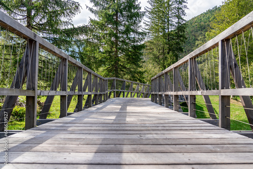 Fototapeta Naklejka Na Ścianę i Meble -  Wooden walking trail for recreation through the forest to the nearby hills, Bohinj, Triglav national park, Slovenia