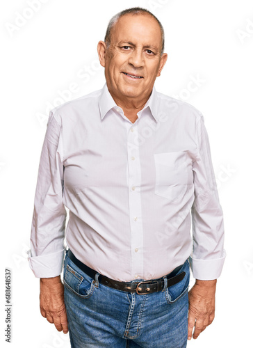 Handsome senior man wearing elegant white shirt winking looking at the camera with sexy expression, cheerful and happy face.