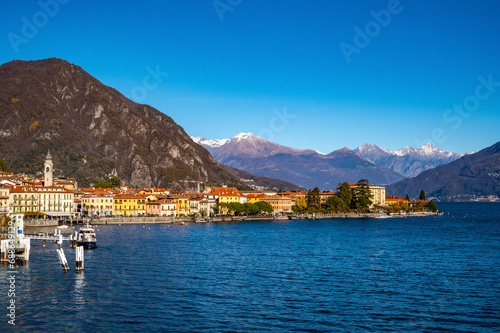 The town of Menaggio with its lakefront, its buildings, and the pier.