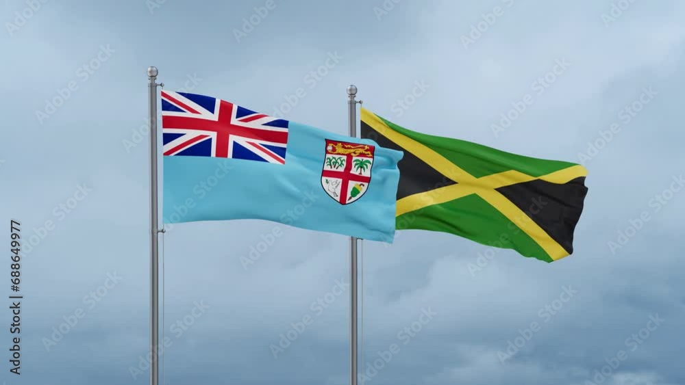 Jamaica and Fiji flag waving together on cloudy sky, endless seamless loop, two country cooperation concept Jamaica and Fiji flag waving together on cloudy sky, endless seamless loop, two country cooperation concept