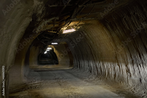 The tunnel of the mine is used by special cars that take miners to their place of work. photo