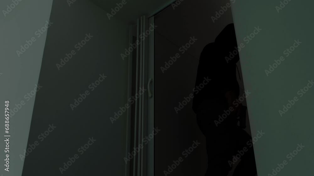 Mysterious Man Wearing Black Hoodie Holding A Pistol Wearing A Cloth