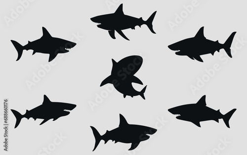 Shark icons on a gray background.  Black silhouette. Vector.