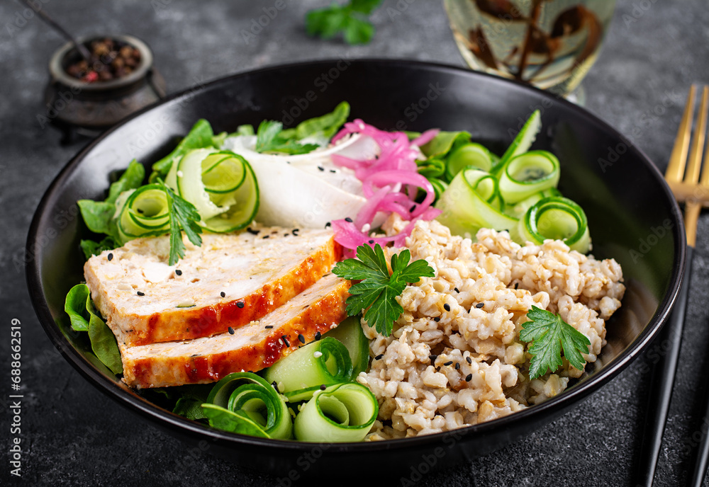Brunch or lunch. Plate with oatmeal, chicken meatloaf, cucumber and green herbs. Health food. Brunch or lunch. Plate with oatmeal, chicken meatloaf, cucumber and green herbs. Health food.