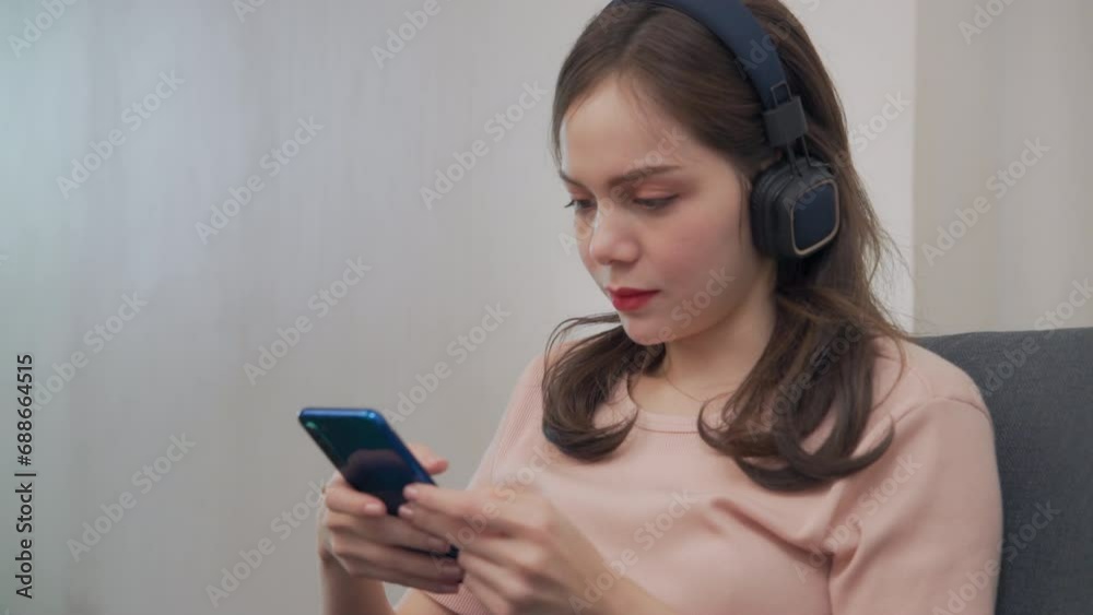 Man wearing casual clothes uses smartphone at coffee shop cafe chatting typing message on cell phone Man wearing casual clothes uses smartphone at coffee shop cafe chatting typing message on cell phone