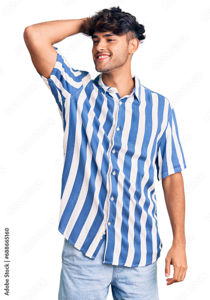 Young hispanic man wearing casual clothes smiling confident touching hair with hand up gesture, posing attractive and fashionable Young hispanic man wearing casual clothes smiling confident touching hair with hand up gesture, posing attractive and fashionable