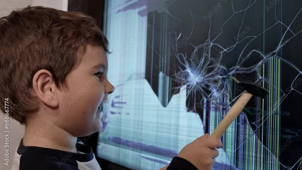 The Handyman in Training: A Young Boy with a Hammer Fixes a Broken Screen TV The Handyman in Training: A Young Boy with a Hammer Fixes a Broken Screen TV
