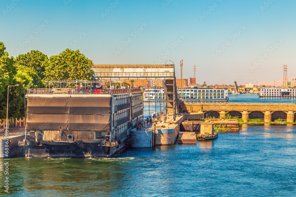 Fototapeta premium Cruise ships pass through the Esna lock.