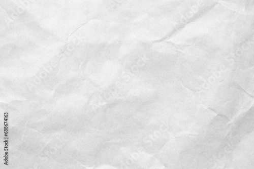 Abstract white crumpled and creased recycle craft paper texture background © Piman Khrutmuang