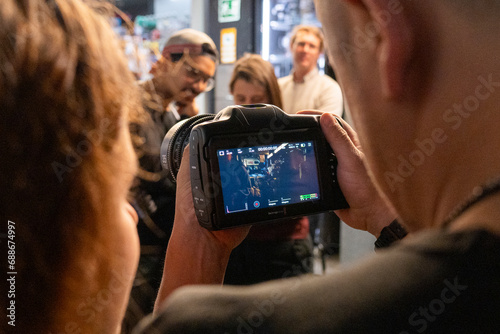 young person is recording videos with his camera