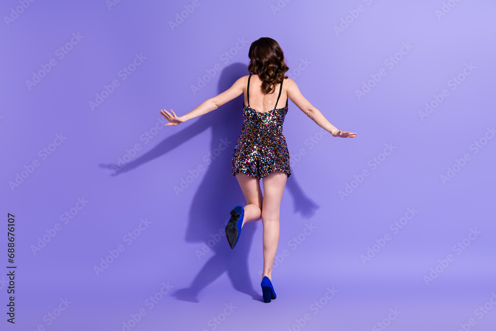 Back rear view photo of attractive chic bachelorette dancing on birthday event occasion isolated violet color background