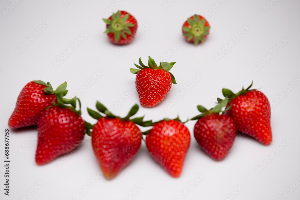Pile of isolated strawberries in white forest berries. Pile of isolated strawberries in white forest berries.