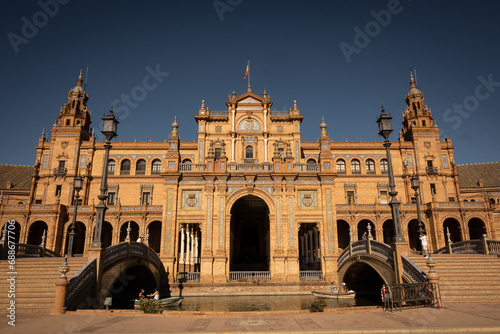 The National Geographic Institute in Plaza de España Seville city Spain. Central government offices in stunning rich wealthy architecture design on sunny day. Impressive symmetrical masonry 