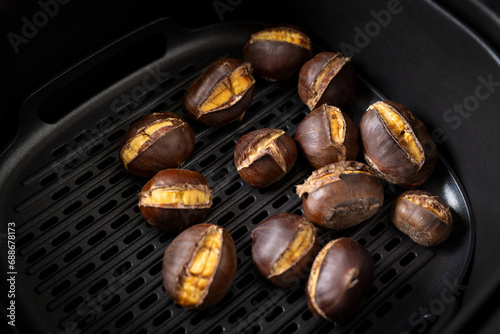 Close-up photo of delicious chestnuts | castanea sativa roasted in an air fryer.