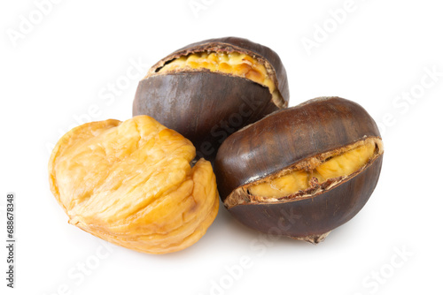 Macro photo of delicious roasted and peeled chestnuts | castanea sativa on white background.