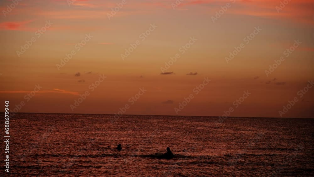 Group of people In the sea At red Sunset Together On Beach Vacation. Group of people In the sea At red Sunset Together On Beach Vacation.