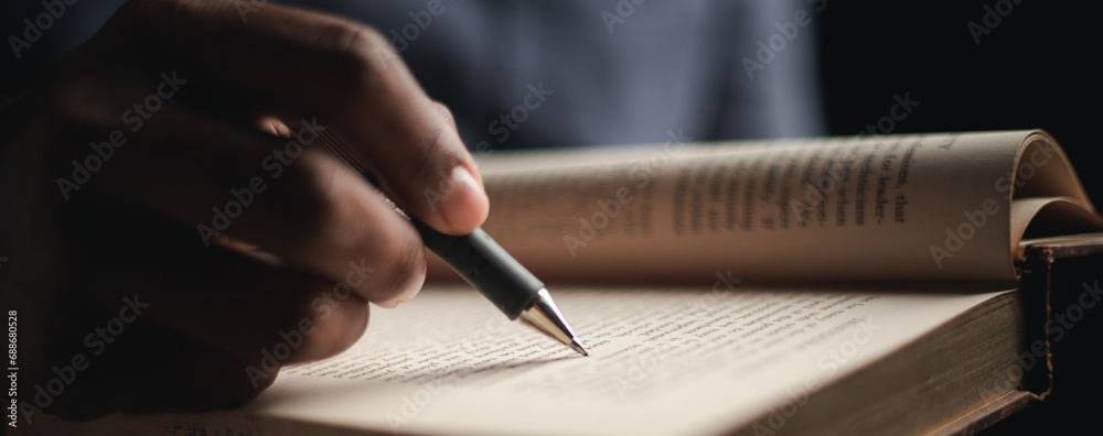 Close up of the handwriting of a student writing in a notebook preparing for an exam or test, diary note , testing, writing job applications, investing Close up of the handwriting of a student writing in a notebook preparing for an exam or test, diary note , testing, writing job applications, investing