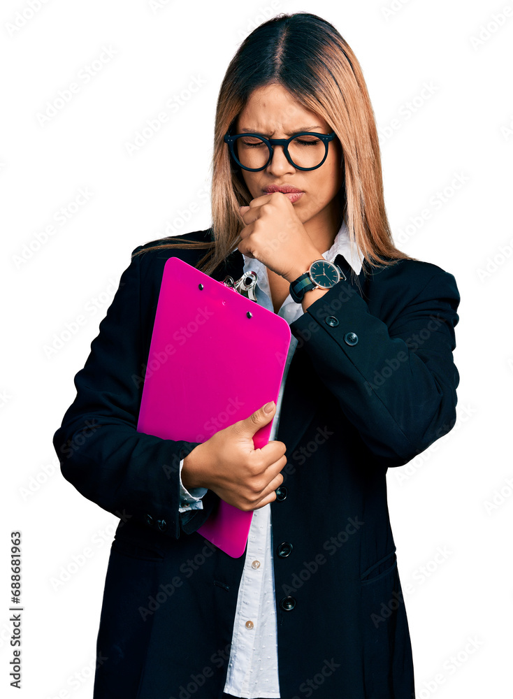 Young hispanic business woman holding clipboard with blank space feeling unwell and coughing as symptom for cold or bronchitis. health care concept.