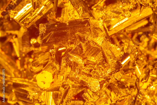 Golden crystal mineral stone. Gems. Mineral crystals in the natural environment. Texture of precious and semiprecious stones. Seamless background with copy space. © Vera
