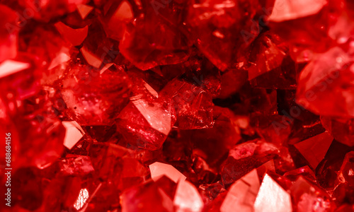 Amethyst red crystals. Gems. Mineral crystals in the natural environment. Texture of precious and semiprecious stones. Seamless background with copy space colored shiny surface of precious stones. photo
