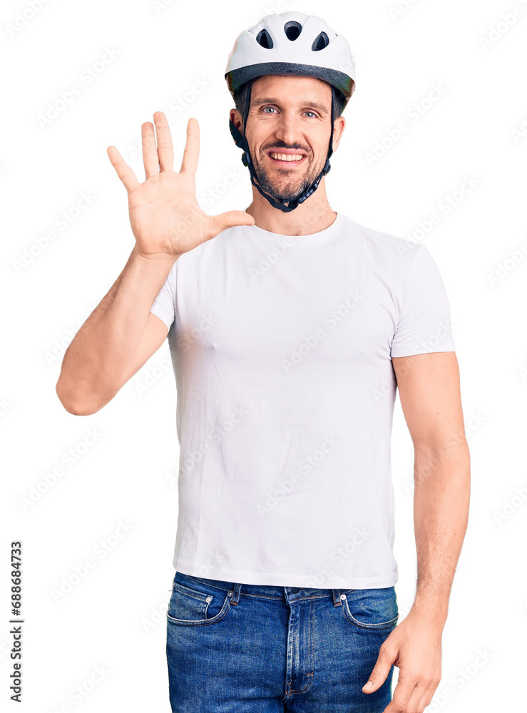 Young handsome man wearing bike helmet showing and pointing up with fingers number five while smiling confident and happy. Young handsome man wearing bike helmet showing and pointing up with fingers number five while smiling confident and happy.