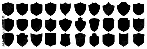 Set of vector shields. Collection of security shield icons. Different shields in black for your design photo