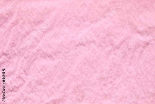 pink crumpled paper texture with grains macro closeup