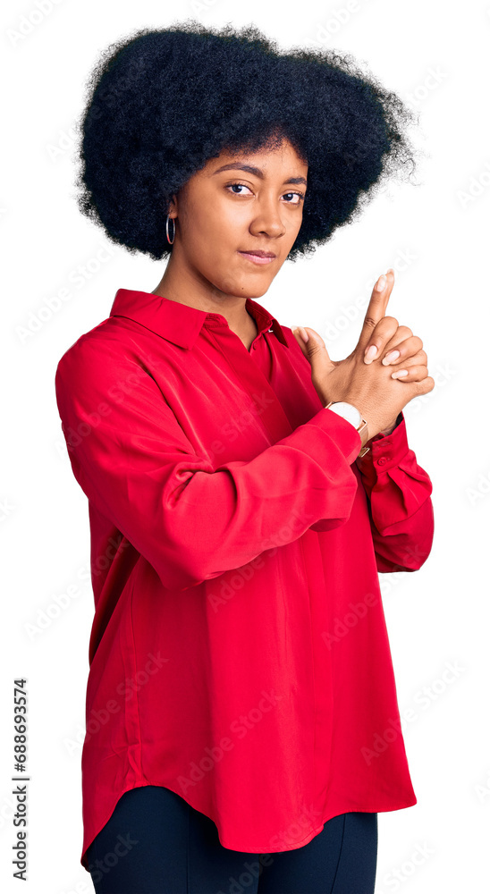 Young african american girl wearing casual clothes holding symbolic gun with hand gesture, playing killing shooting weapons, angry face Young african american girl wearing casual clothes holding symbolic gun with hand gesture, playing killing shooting weapons, angry face