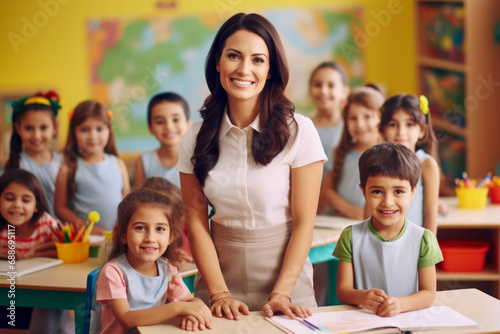 Portrait of a gorgeous Hispanic preschool teacher teaching her students in a classroom.