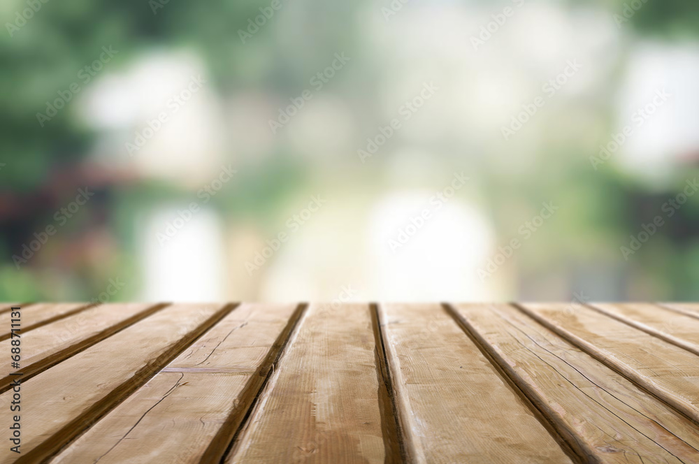 Wooden table or surface with blurred summer forest background Wooden table or surface with blurred summer forest background