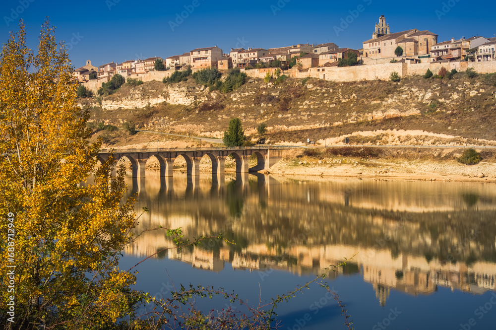 View of Maderuelo reflected on the water of Linares reservoir