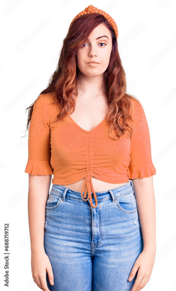 Young beautiful woman wearing casual clothes with serious expression on face. simple and natural looking at the camera. Young beautiful woman wearing casual clothes with serious expression on face. simple and natural looking at the camera.