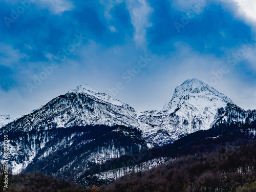 Fototapeta Naklejka Na Ścianę i Meble -  Winter view of the mountains Krasnaya Polyana, Rosa Khutor, Olympic Village, Estosadok, Sochi