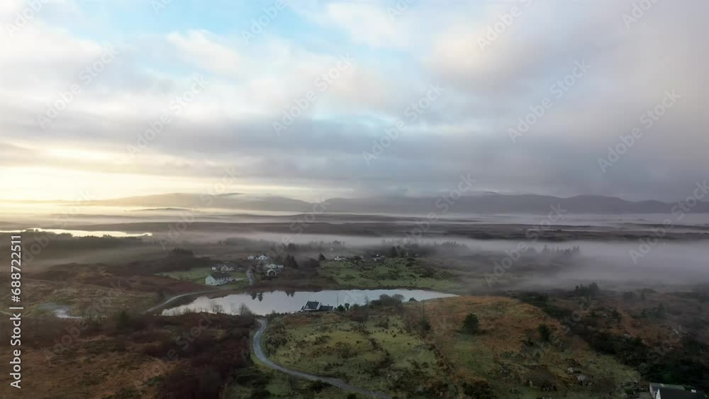 Aerial view of Bonny Glen by Portnoo in the fog, County Donegal - Ireland. Aerial view of Bonny Glen by Portnoo in the fog, County Donegal - Ireland.