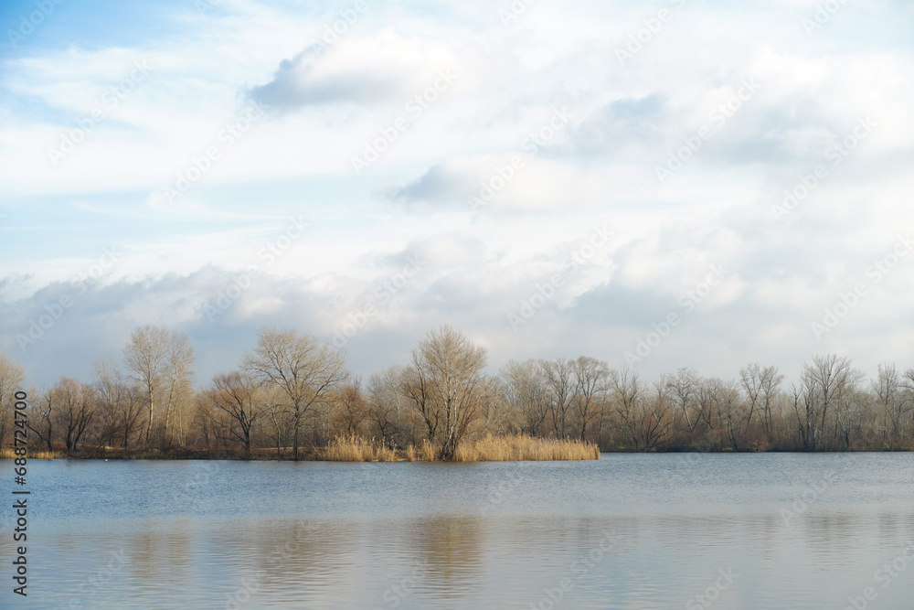 Sad autumn river landscape with cloudy sky Sad autumn river landscape with cloudy sky